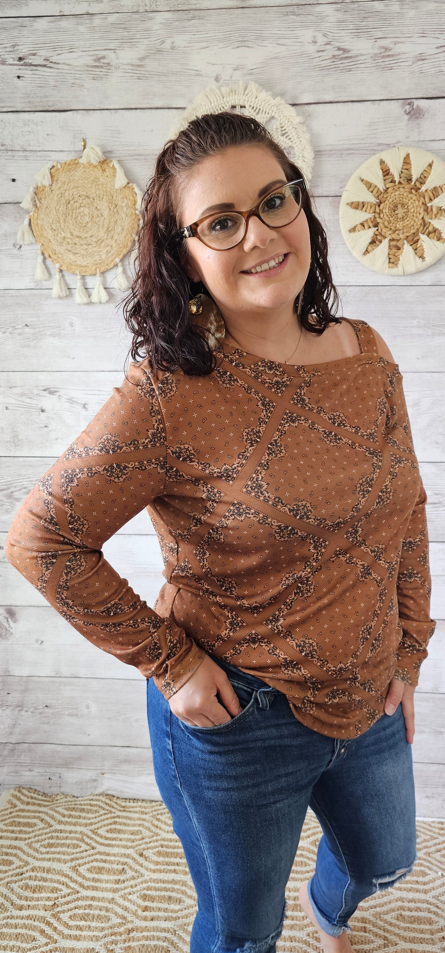 This top features one cold shoulder with strap, long sleeves, with bandana print.  Light weight and breathable. Go ahead and wear it line dancing, to the rodeo, hanging out with your friends, or just running errands.  You know that you want to give it a try! Sizes small through x-large.