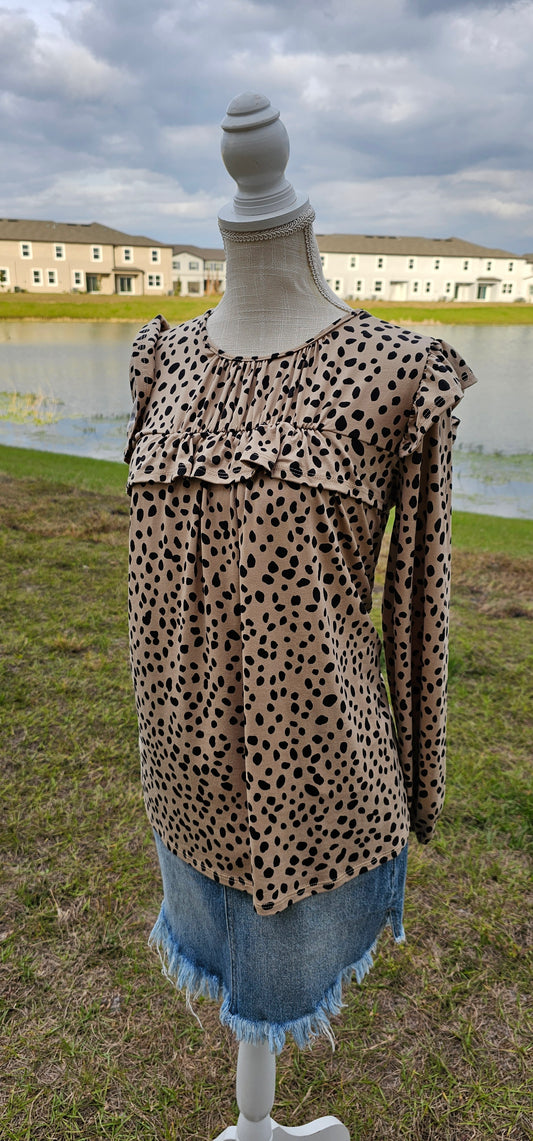 Long sleeve top with a pleaded neckline, ruffles on chest and shoulders, elastic sleeves. Sizes small through x-large.