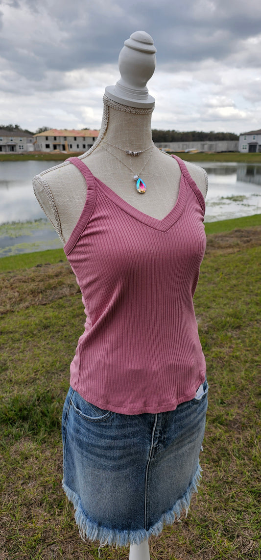 This “Basic Babe Tank Top: Dusty Rose” features a ribbed fabric, sleeveless tank top with v-neck and back. This is a great basic staple piece! Sizes small through x-large.