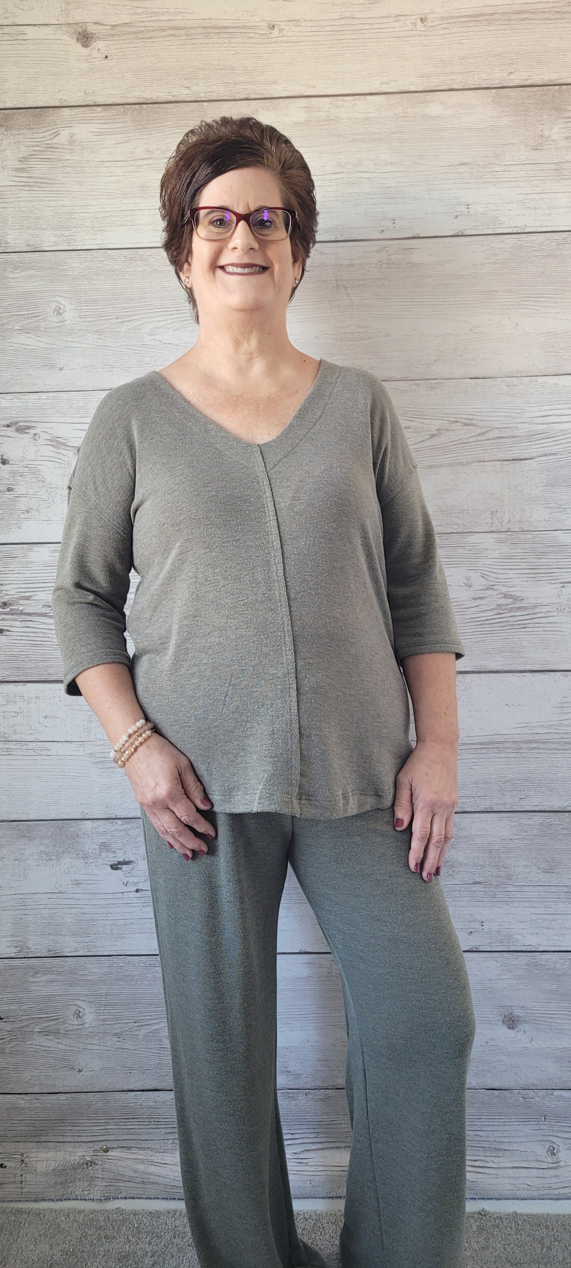 Step out in style in this comfy cropped lounge set! Its deep v-neck pullover features cut edge detail and half sleeves, while the comfy wide leg pants come with an elastic waistband and drawstring for the perfect fit. With rounded bottom hem and drop shoulder, this set is sure to take your look to the next level! Let’s get comfy and stylish, shall we? Sizes small through large.