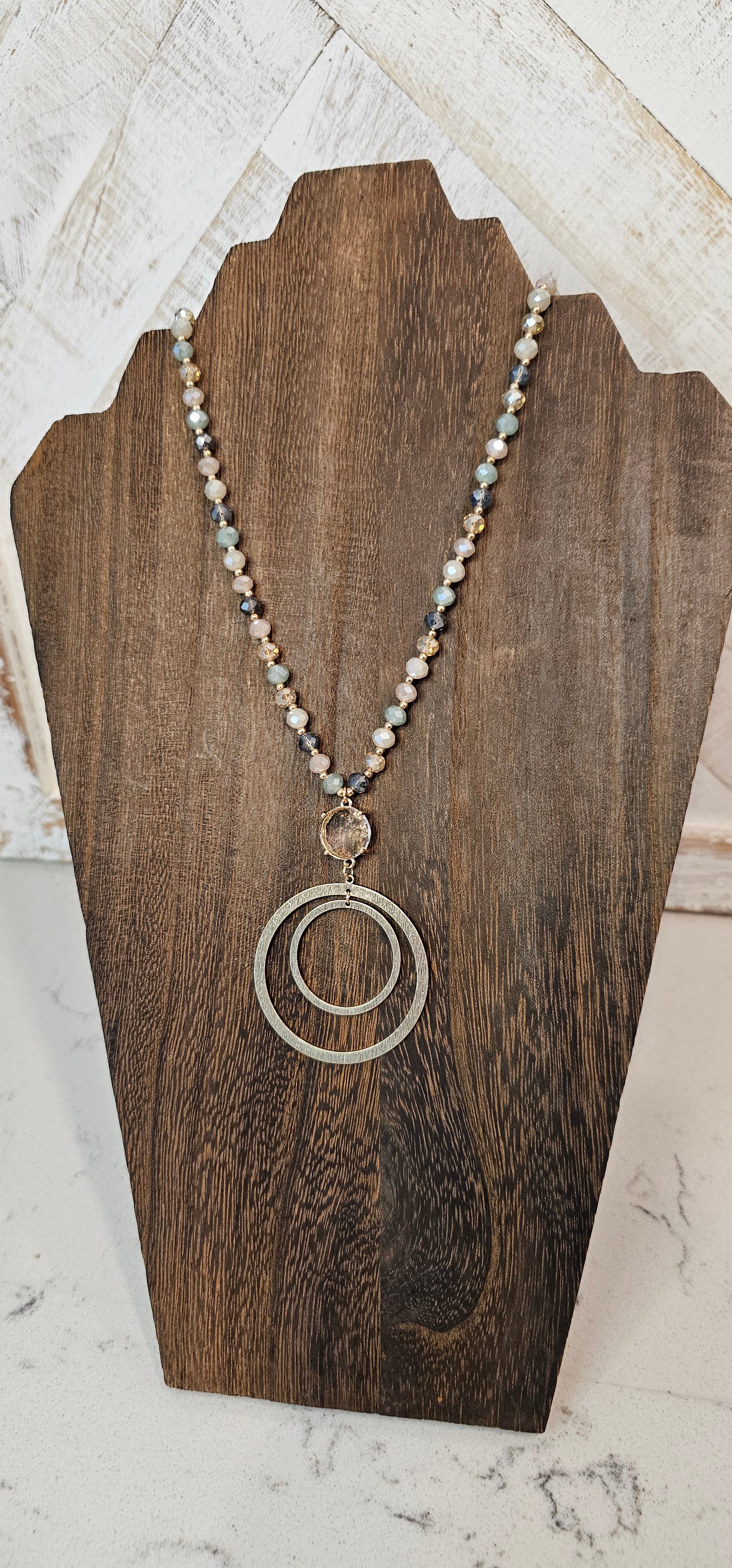 Approximate Length: Adjustable 32+2 inches Color: Gold link chain with various blue-gray glass beads, clear crystal and floating circle pendants Limited supply!  