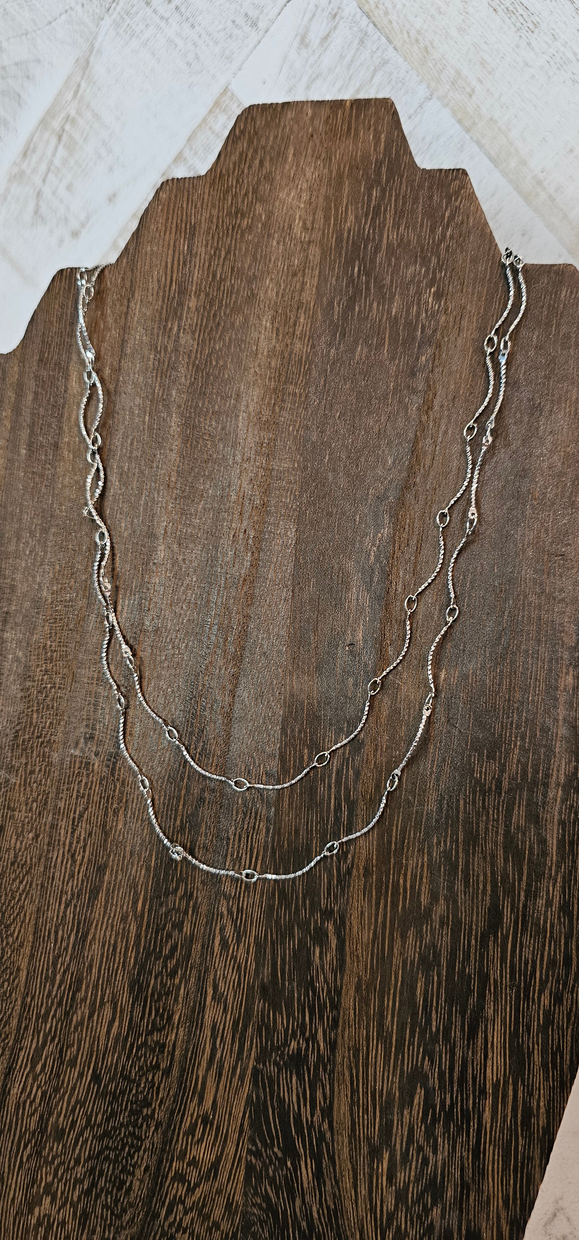 Approximate Length: Adjustable chain 16+2 inches Color: Silver wavy link chain Limited supply!  