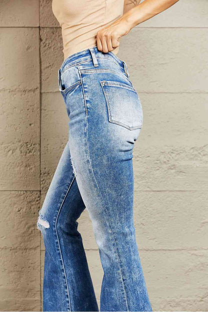 These jeans offer a flattering fit that hugs your curves while providing all-day comfort. The distressed detailing on the knee adds a touch of edginess to your look, while the raw cut hem lends a trendy and contemporary vibe. 