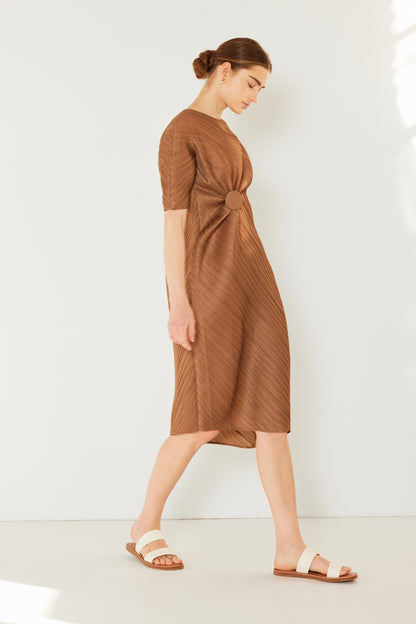 The Pleated Dolman Sleeve Dress is a modern and chic addition to your wardrobe. With its unique dolman sleeves and pleated detailing, this dress offers a stylish and sophisticated look. The relaxed silhouette and pleats create a flattering and comfortable fit.