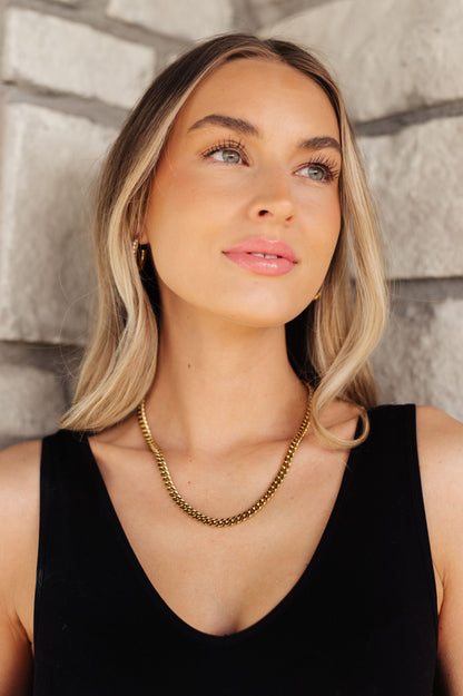 Introducing the Chain Reaction Gold Plated Choker! Crafted with 18K gold plated stainless steel and a classic choker design, this necklace is a beautiful and timeless addition to any jewelry collection. The Cuban link chain ensures durability while shining for many years to come.  18K gold plated stainless steel means you can wear this piece to the beach, the pool, or even working out without worrying over tarnishing, green marks, or skin irritation.