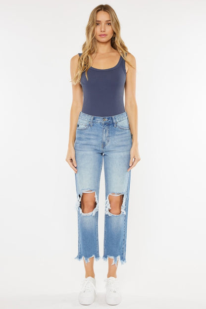 High Waist Chewed Up Straight Mom Jeans are the ultimate combination of vintage-inspired style and trendy edge. These jeans, with their high waistline, provide a flattering and comfortable fit that accentuates your curves. 