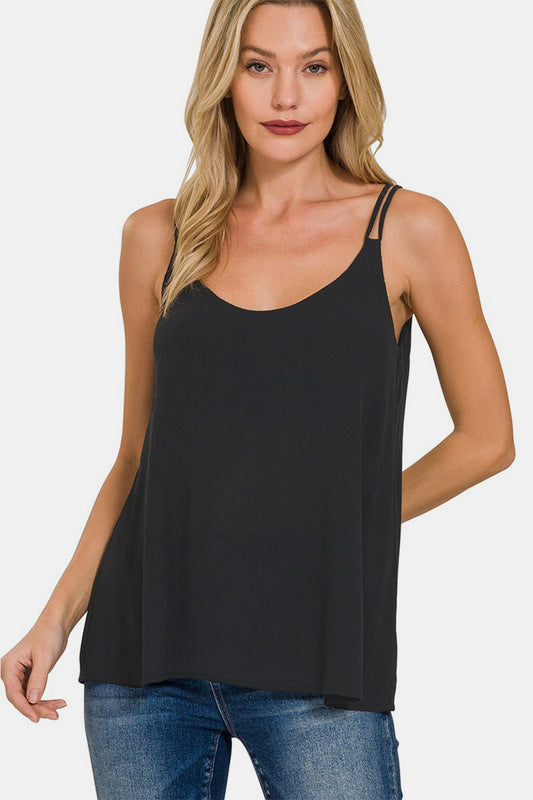 The Woven Double Spaghetti Strap V-Neck Cami is a stylish and versatile top that is perfect for layering or wearing on its own. The double spaghetti straps add a touch of sophistication and detail to the V-neckline. Made from woven fabric, this cami drapes beautifully and feels luxurious against the skin.  S - L