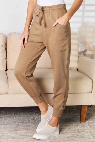 These joggers offer a relaxed fit with a flattering high-rise waistline, ensuring both comfort and a chic silhouette. The side pockets add functionality, perfect for keeping your essentials close at hand while on the go. S - XL