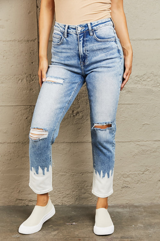 These jeans are the perfect blend of fashion and comfort, featuring a flattering high waist design that accentuates your curves while providing a comfortable fit. The medium wash adds a touch of vintage charm, while the distressed detailing gives them a chic and edgy look. 