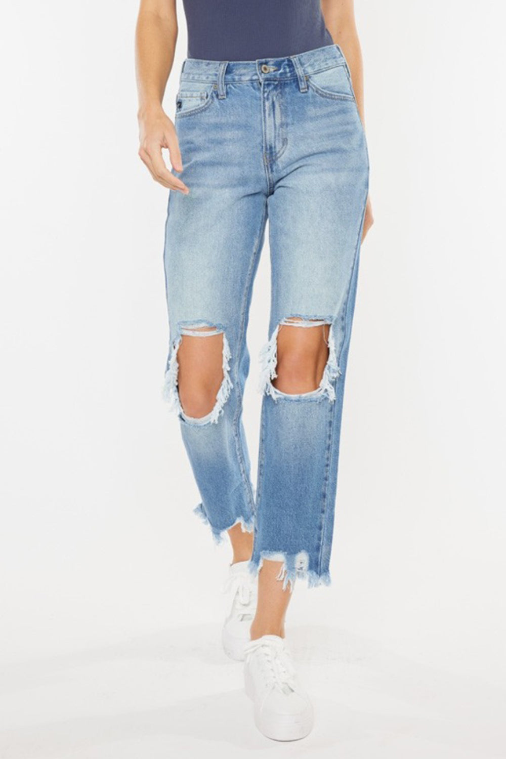 High Waist Chewed Up Straight Mom Jeans are the ultimate combination of vintage-inspired style and trendy edge. These jeans, with their high waistline, provide a flattering and comfortable fit that accentuates your curves. 