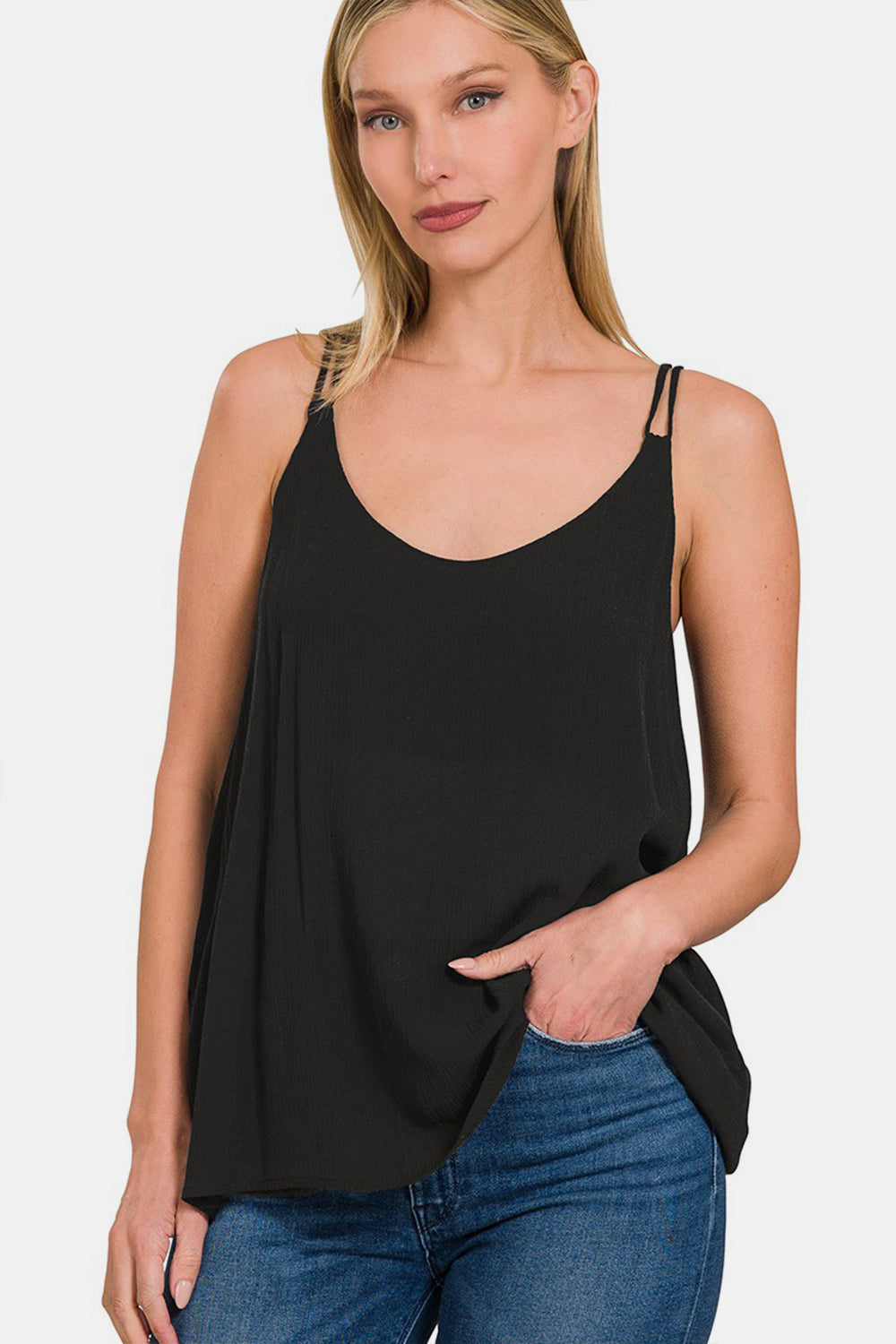 The Woven Double Spaghetti Strap V-Neck Cami is a stylish and versatile top that is perfect for layering or wearing on its own. The double spaghetti straps add a touch of sophistication and detail to the V-neckline. Made from woven fabric, this cami drapes beautifully and feels luxurious against the skin.  S  - L