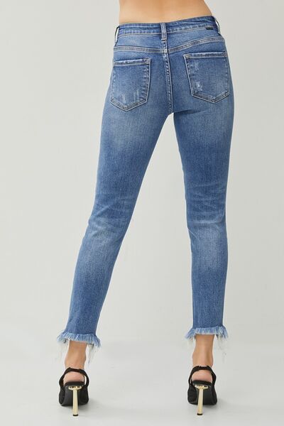 These Distressed Frayed Hem Slim Jeans are a must-have for anyone who loves a touch of edginess in their wardrobe. The distressed detailing adds a cool and rebellious vibe to these jeans, giving them a unique and trendy look. The slim fit design hugs your curves in all the right places, creating a flattering and stylish silhouette.