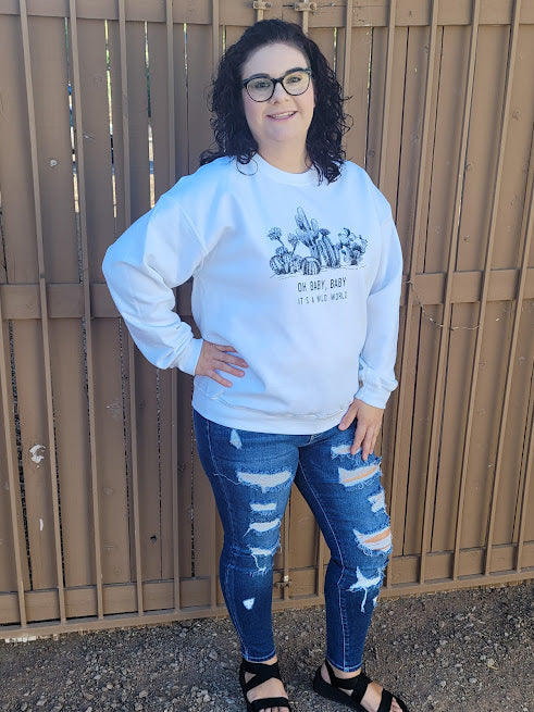 This is a comfy white long sleeved sweatshirt featuring a cactus design with black lettering.  The material is very soft. Wear this with your favorite jeans or leggings. This would be the perfect sweatshirt for everyday wear, hanging out with your family and friends around the campfire,  running errands, or to cozy up with that someone special.  Sizes small through large.
