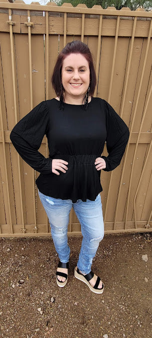 This black long sleeved top with cinched waist and scoop neckline is a must have staple to your wardrobe. "Meant To Be" is a unique black top, so you will be the only one on the block wearing this cute top. Dress it up, or use it as a casual piece. 