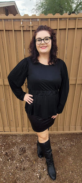 This black long sleeved cinched waist, with a scoop neckline is a must have staple to your wardrobe. This is a unique black top, so you will be the only one on the block with this cute top.  Dress it up, or use it as a casual piece. 