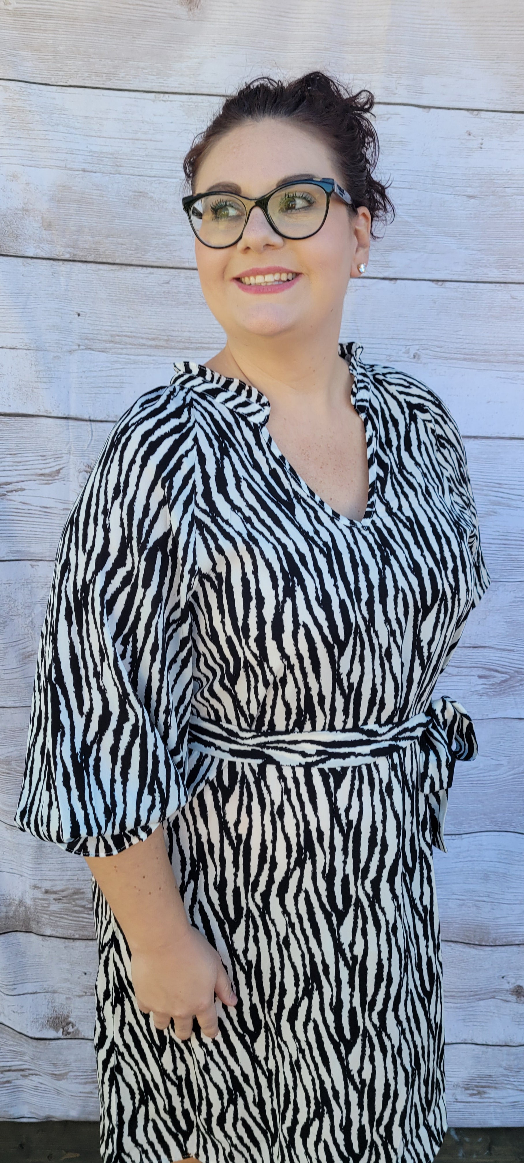 Get in touch with your bold and wild side! This dress is classy, sassy, and badassy! Colors are black and off white. This zebra print dress features a ruffle collar, ¾ balloon sleeves with ruffles, waist tie, v-neck, and sits below the knees. Good for a night out with the girls, office or business attire. Don’t be afraid to get creative!