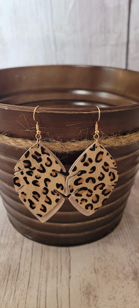 ﻿Tan Leopard Leaf Earrings  Tan genuine leather Leopard print Two layer leaf Gold fish hook Rubber earring back Length 2.56”, width 1.57” Country or western look Whether you want to be on the wild side or classy this earring set it will add a fun touch to your outfit