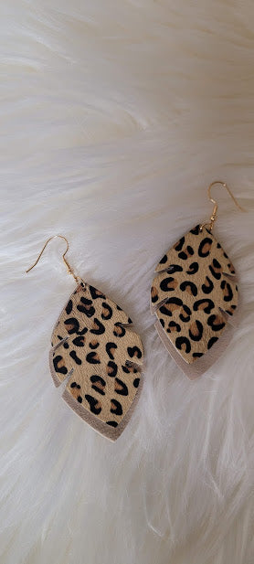 ﻿Tan Leopard Leaf Earrings  Tan genuine leather Leopard print Two layer leaf Gold fish hook Rubber earring back Length 2.56”, width 1.57” Country or western look Whether you want to be on the wild side or classy this earring set it will add a fun touch to your outfit