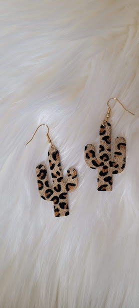 ﻿Light Brown Leopard Cactus Earrings  Light brown genuine leather Leopard print Gold fish hook Country or western look Whether you want to be on the wild side or classy this earring set it will add a fun touch to your outfit