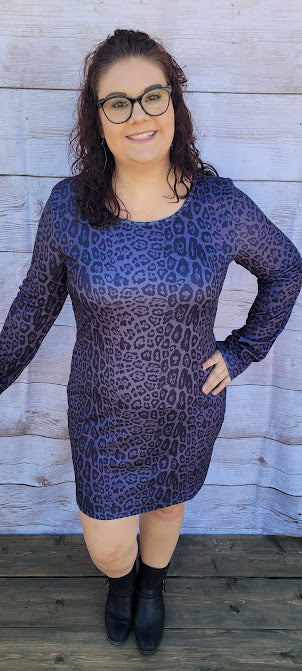 Lady Luck  Description  Listen to your inner voice, it's saying pick me!  This cute and cozy animal print dress is sure to turn heads.  It features a rounded front neckline, V -back with a cutout back, and long sleeves and comes right above the knee.  How about a night out on the town with the girls, rodeo, going to the office, or a date night.  You will feel comfortable all night long. Sizes small through x-large
