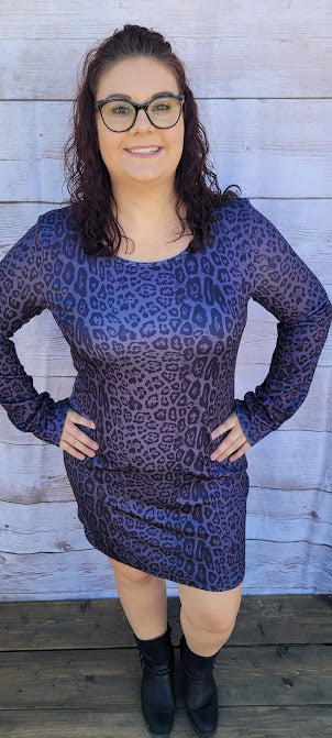 Lady Luck  Description  Listen to your inner voice, it's saying pick me!  This cute and cozy animal print dress is sure to turn heads.  It features a rounded front neckline, V -back with a cutout back, and long sleeves and comes right above the knee.  How about a night out on the town with the girls, rodeo, going to the office, or a date night.  You will feel comfortable all night long. Sizes small through x-large