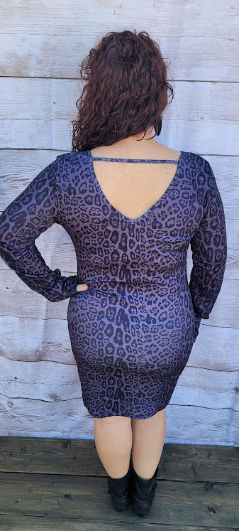 Lady Luck  Description  Listen to your inner voice, it's saying pick me!  This cute and cozy animal print dress is sure to turn heads.  It features a rounded front neckline, V -back with a cutout back, and long sleeves and comes right above the knee.  How about a night out on the town with the girls, rodeo, going to the office, or a date night.  You will feel comfortable all night long. Sizes small through x-large