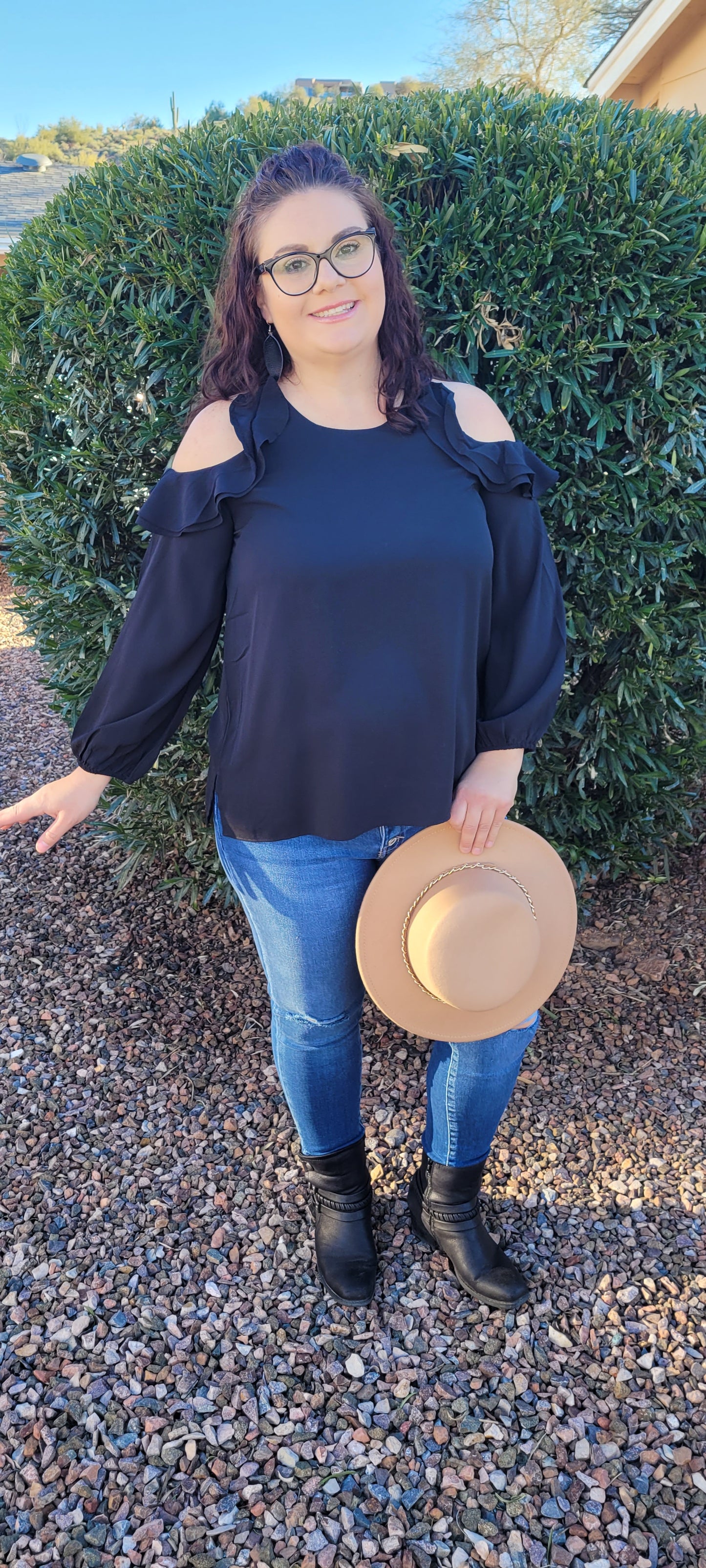 The Twilight top is a must have staple in your closet. This black top features puff sleeves, with an elastic cuff, open ruffled cold shoulder long sleeves, and rounded neckline. This top is light weight, so it can be worn in the summer, spring, fall or winter. You can dress this number up, or leave it the way it is, since it's just so darn cute.  Sizes small through large.