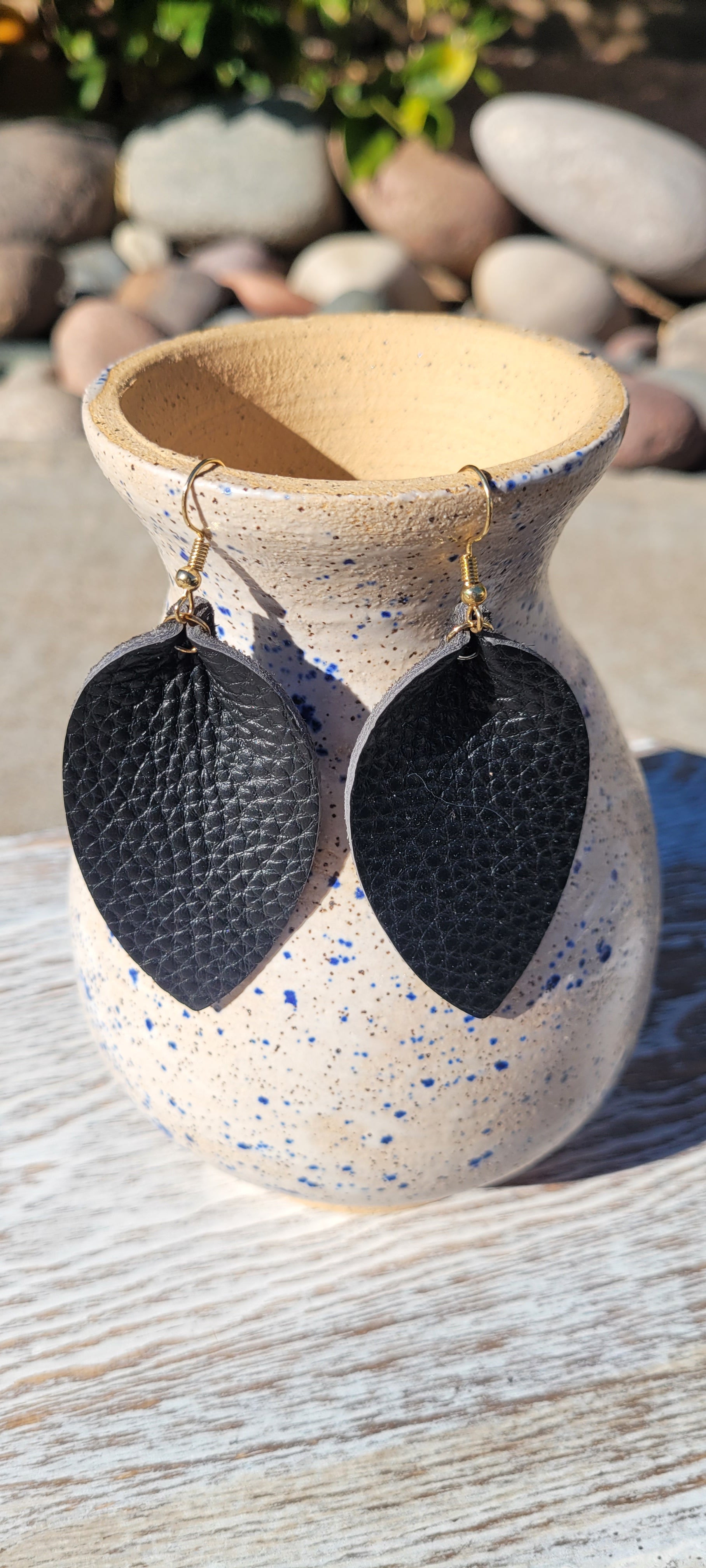 Teardrop shape Black genuine leather Shiny black Brushed gold fish hook dangle earrings Rubber earring back Whether you want to be on the wild side or classy this earring set it will add a fun touch to your outfit
