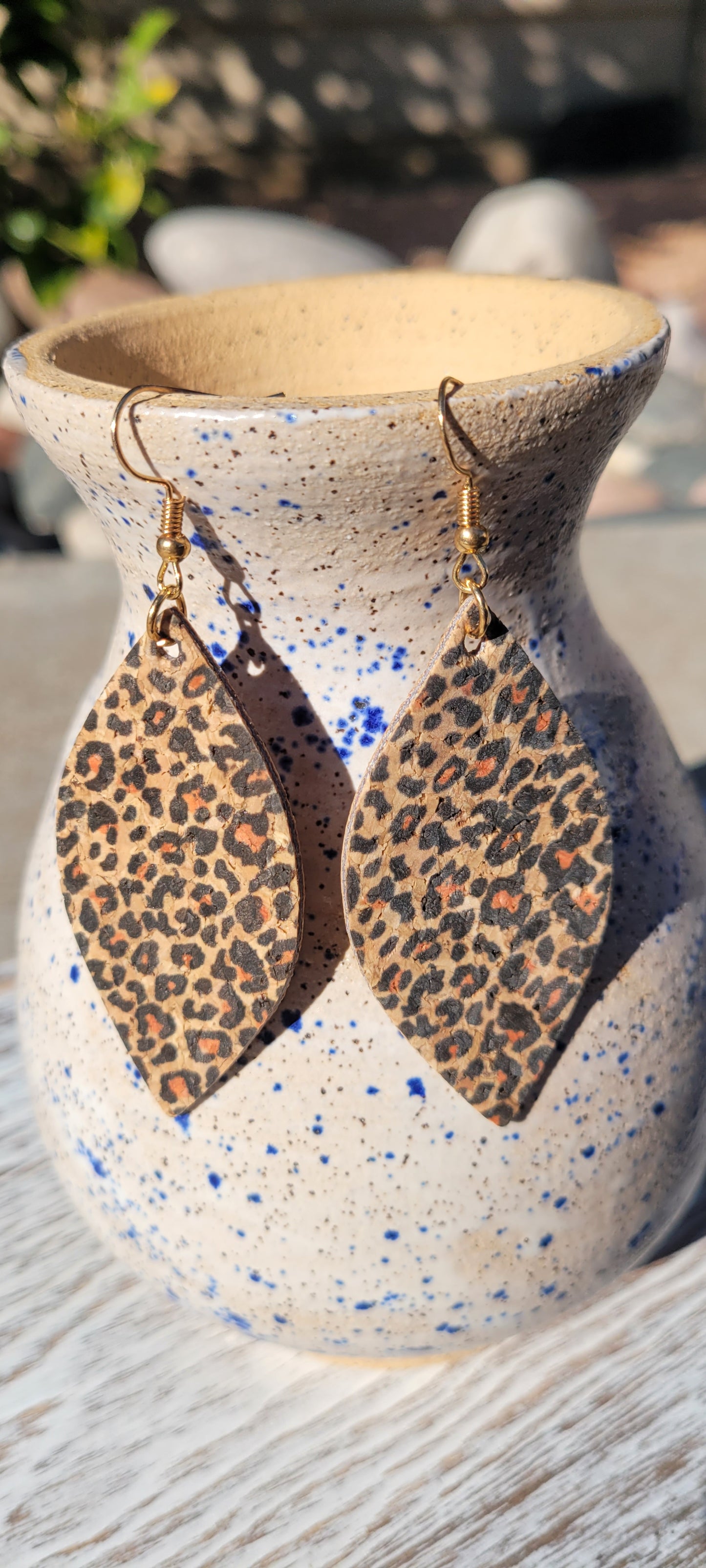 Marquise shape Leopard print cork Brushed gold fish hook dangle earrings Rubber earring back Drop length 3” Whether you want to be on the wild side or classy this earring set it will add a fun touch to your outfit