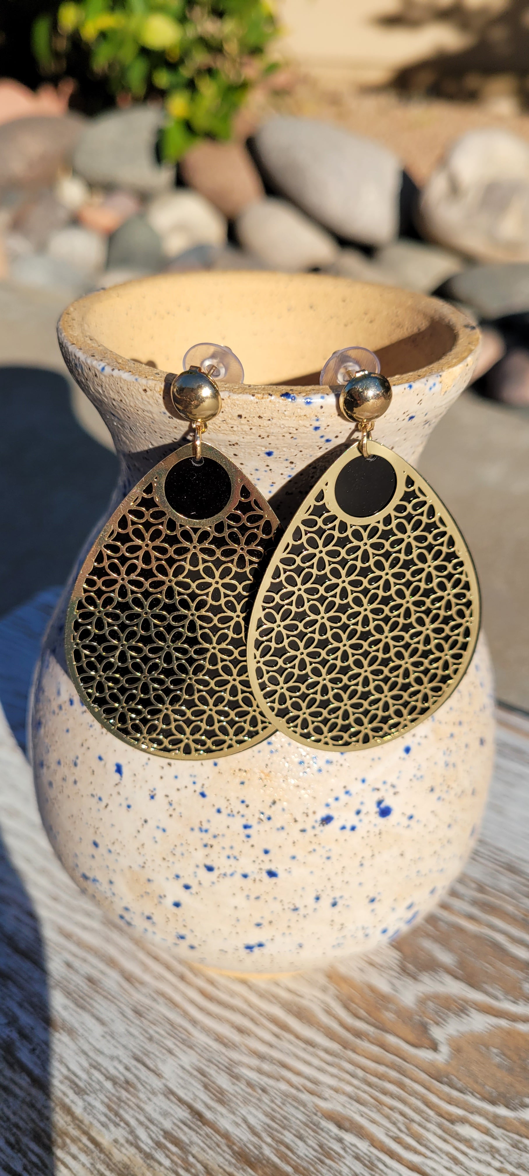 Pear shape Layered brushed gold metal and black acrylic Brushed gold stud dangle earrings Rubber earring back Drop length 1.625” Whether you want to be on the wild side or classy this earring set it will add a fun touch to your outfit