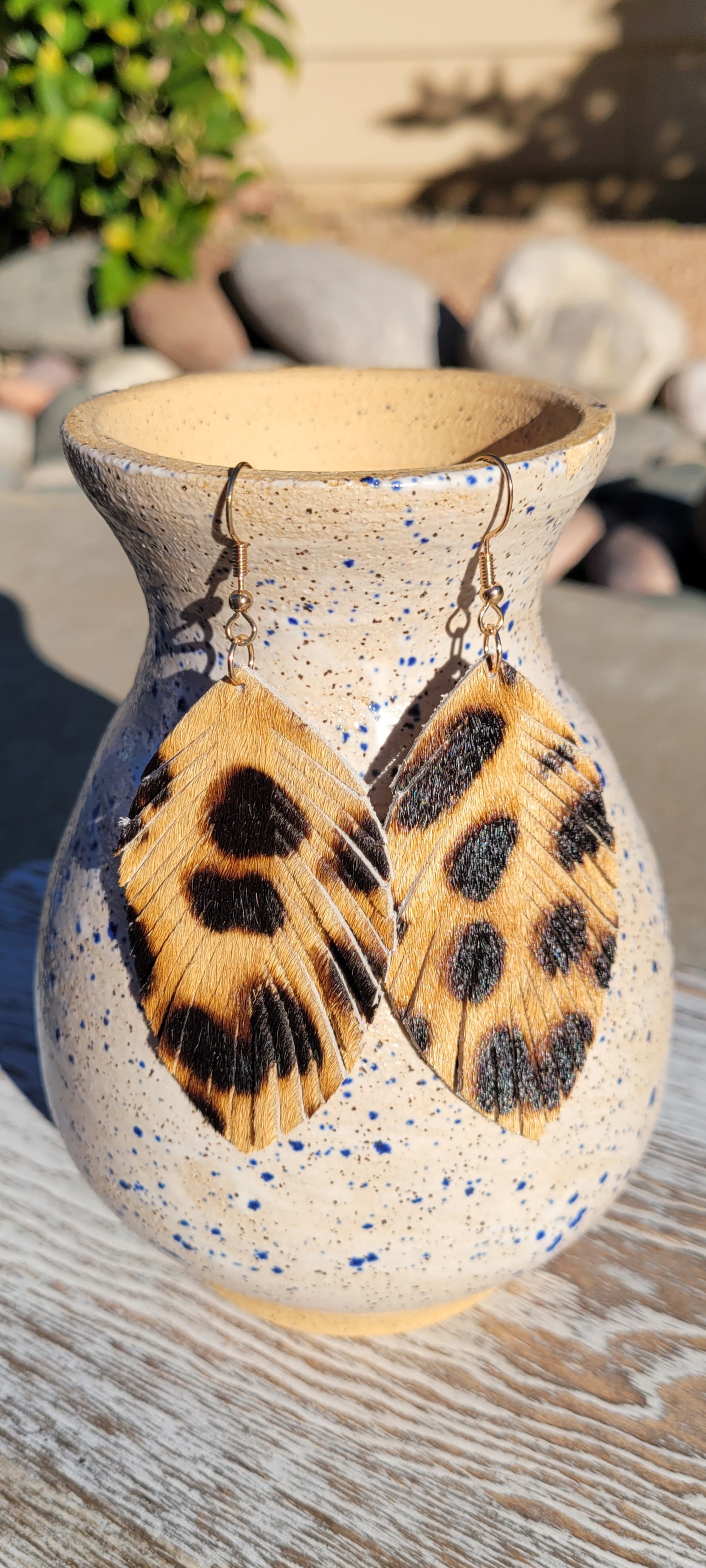 Marquise shape Genuine leather Leopard print Feathered fringe Brushed gold fish hook dangle earrings Rubber earring back Drop length 2.6”, width 1.5” Whether you want to be on the wild side or classy this earring set it will add a fun touch to your outfit