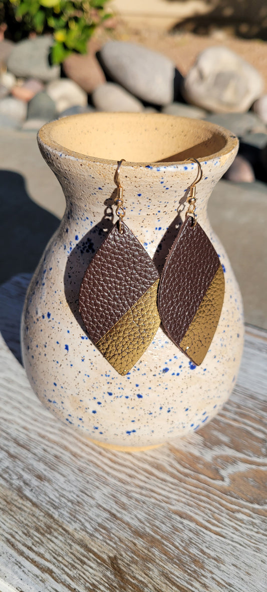 Marquise shape Brown genuine leather Dipped in metallic gold Brushed gold fish hook dangle earrings Rubber earring back Whether you want to be on the wild side or classy this earring set it will add a fun touch to your outfit