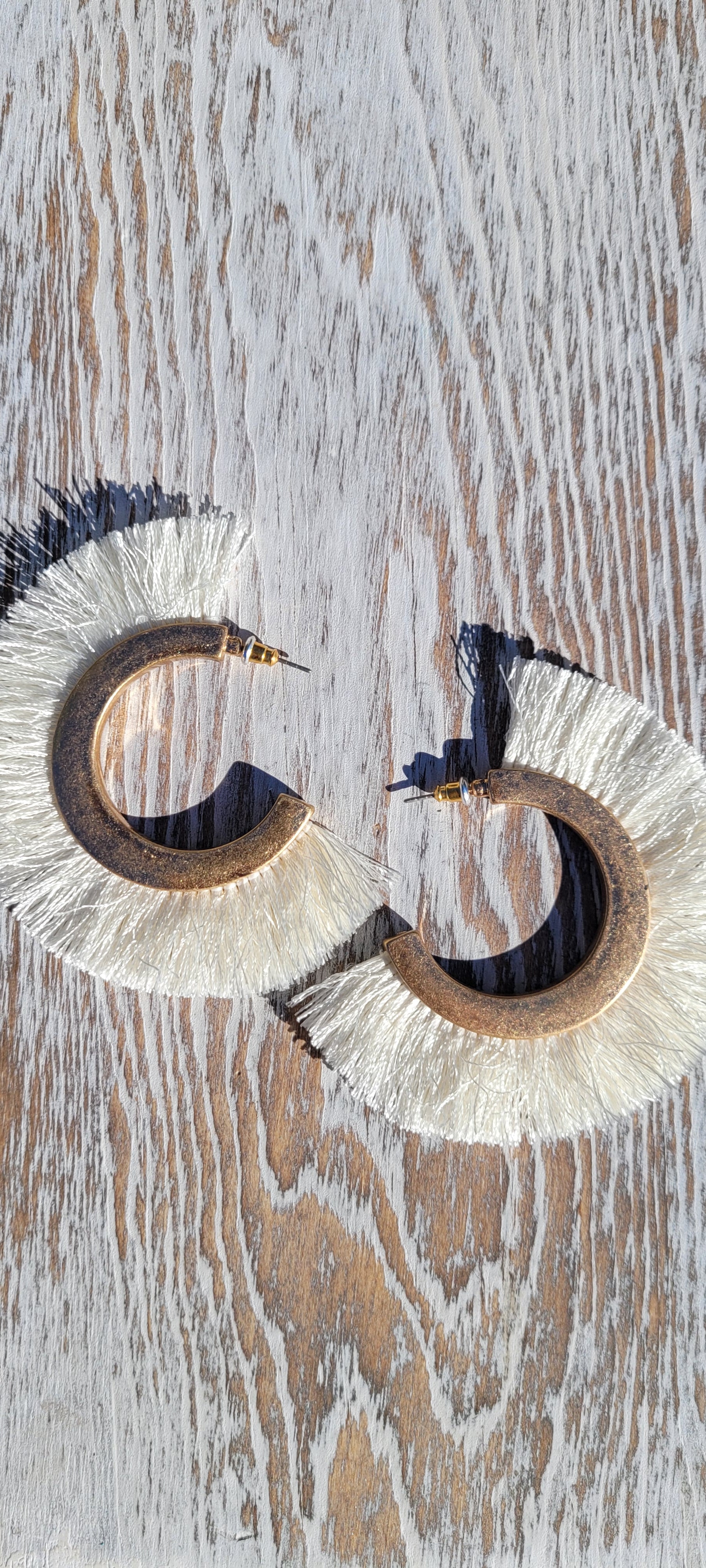 Ivory tassels Brushed gold hoops Brushed gold stud earrings Metal earring back Diameter 3” Whether you want to be on the wild side or classy this earring set it will add a fun touch to your outfit