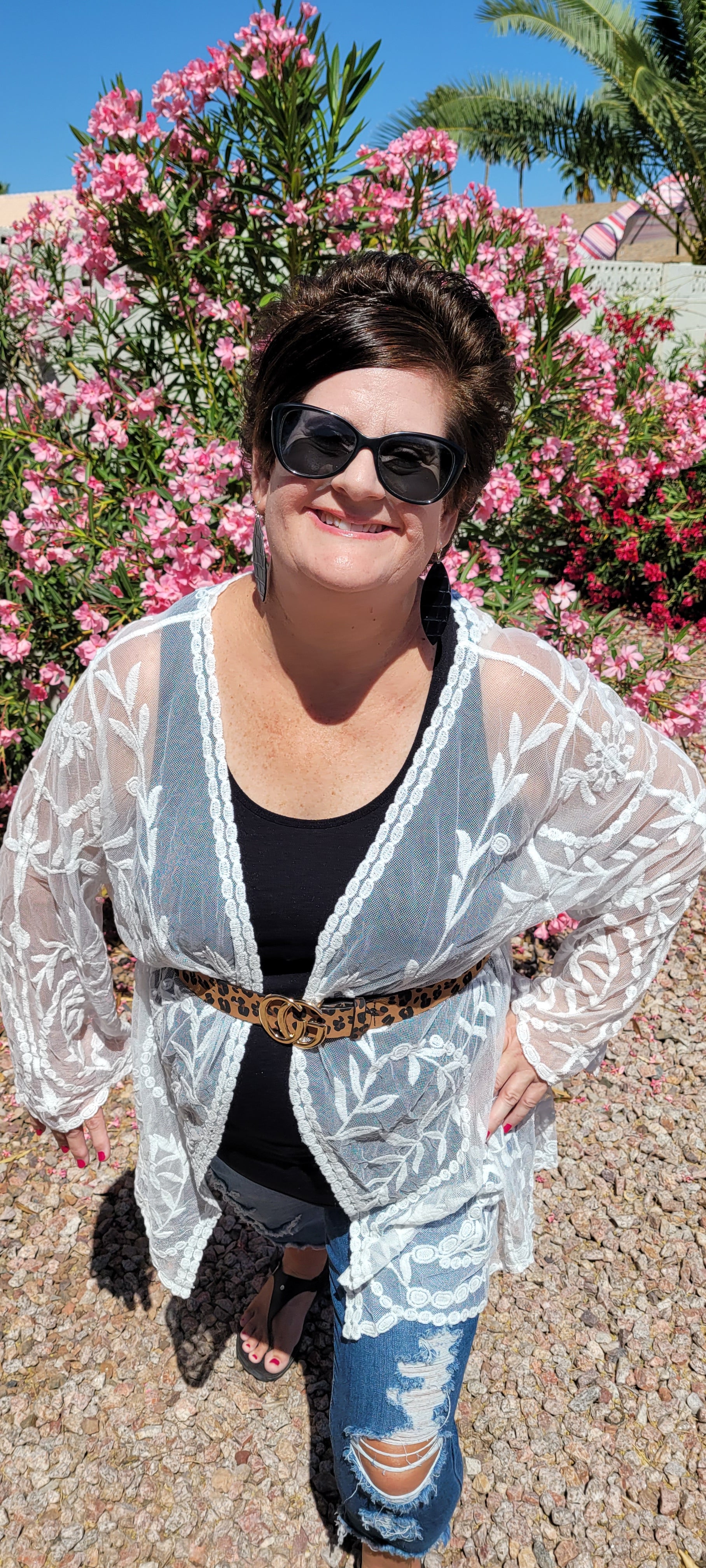 “The Beach Is Calling” is a sheer lightweight kimono. This kimono features an open front, long bell sleeves, scalloped hemline, and crochet leaf design. This is the perfect lightweight essential. This white kimono is very versatile. You can dress this up or take it to the beach! The choice is yours! Sizes small/medium and medium/large.