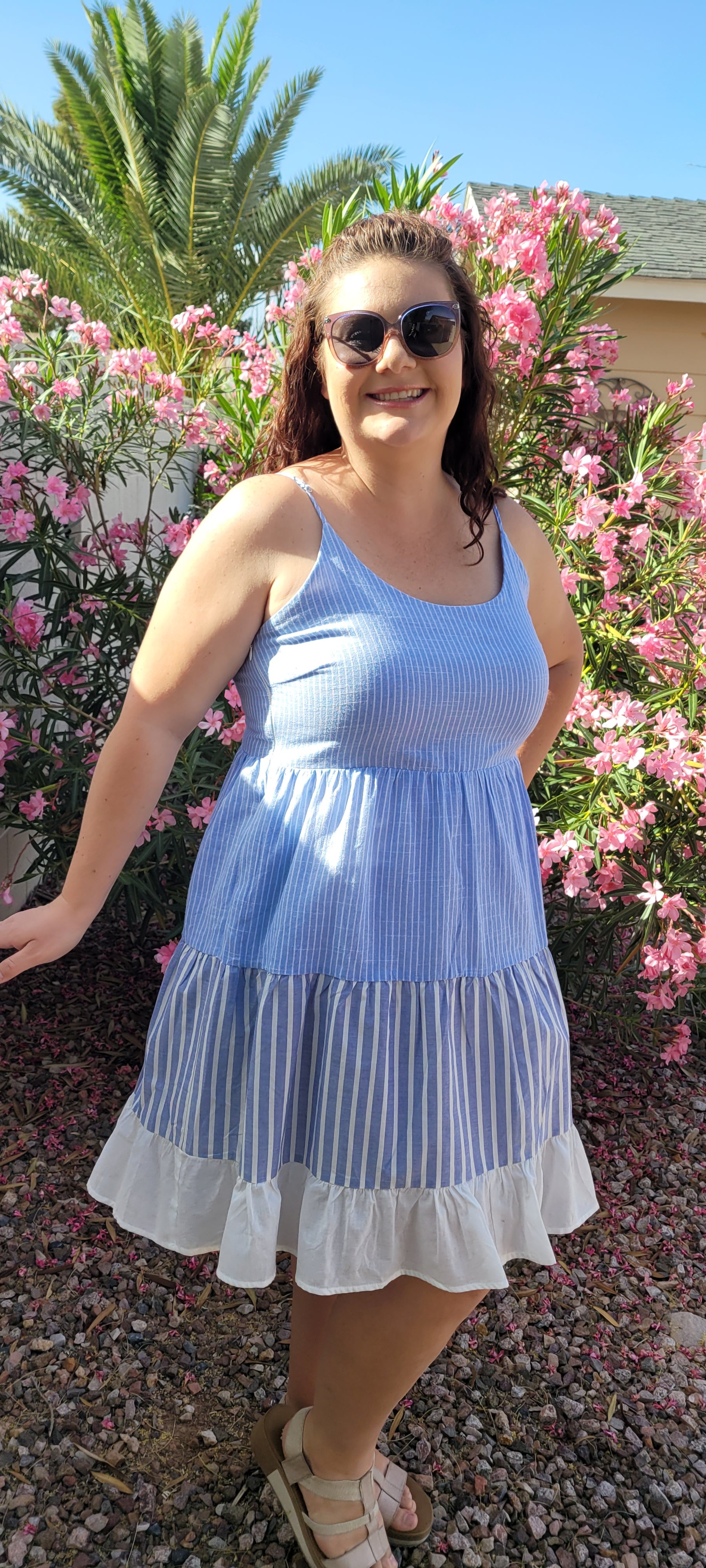 “Beach Hopper” is a midi dress with layers of tiered striped prints. This dress features a white ruffled hemline, adjustable straps, zipper on side with clasp closure, scoop neckline and back, it is lined and does not have stretch. This dress is perfect for a beach getaway! Sizes small through large.
