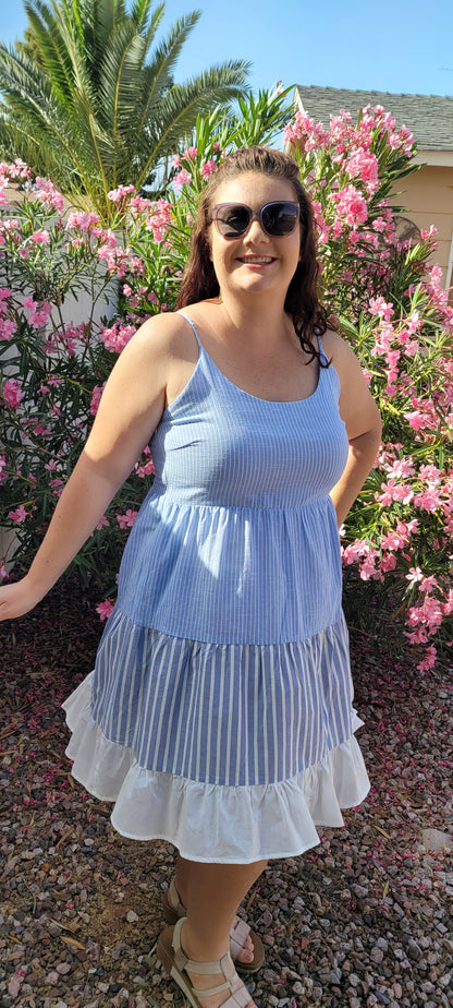 “Beach Hopper” is a midi dress with layers of tiered striped prints. This dress features a white ruffled hemline, adjustable straps, zipper on side with clasp closure, scoop neckline and back, it is lined and does not have stretch. This dress is perfect for a beach getaway! Sizes small through large.