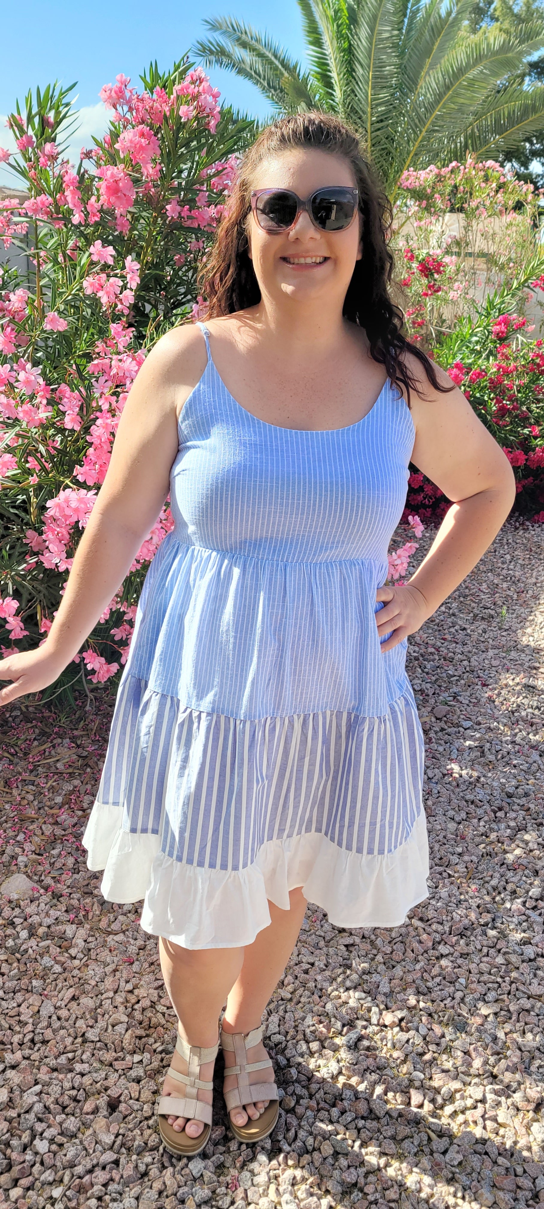 “Beach Hopper” is a midi dress with layers of tiered striped prints. This dress features a white ruffled hemline, adjustable straps, zipper on side with clasp closure, scoop neckline and back, it is lined and does not have stretch. This dress is perfect for a beach getaway! Sizes small through large.
