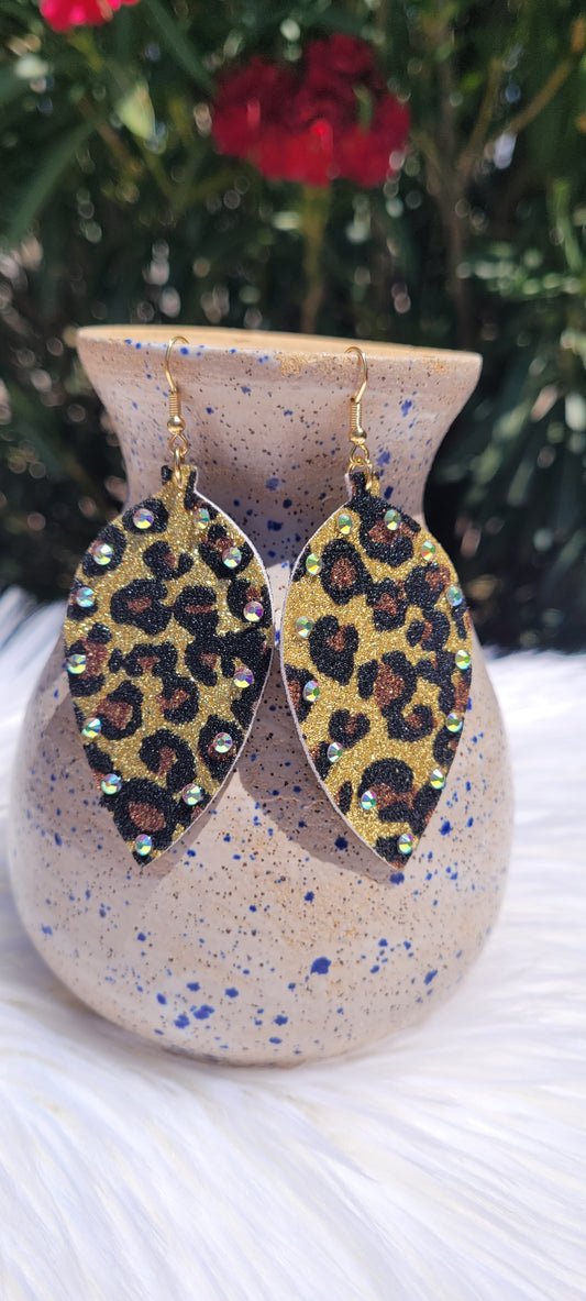 Leaf shape Gold sparkle Black, mocha, gold leopard print Pink rhinestones Brushed gold fish hook dangle earrings Rubber earring back Whether you want to be on the wild side or classy this earring set it will add a fun touch to your outfit