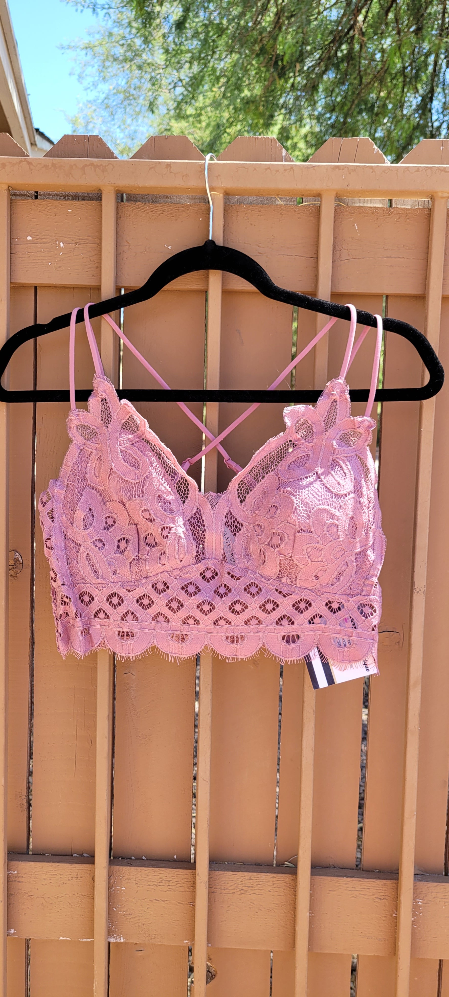 This bralette is a must have staple piece! It is easy for layering or great all by itself! This bralette is super comfy and can easily replace your current bra. No need to worry about clasps, this bralette easily slips over your head. It also features a floral crochet lace, ruched stretchy back, four adjustable straps with crisscross detail in back, and removable bra pads. Color is dusty rose. Pair with your favorite jacket or off the shoulder sweater. Don’t be afraid to get creative! Sizes small to x-large