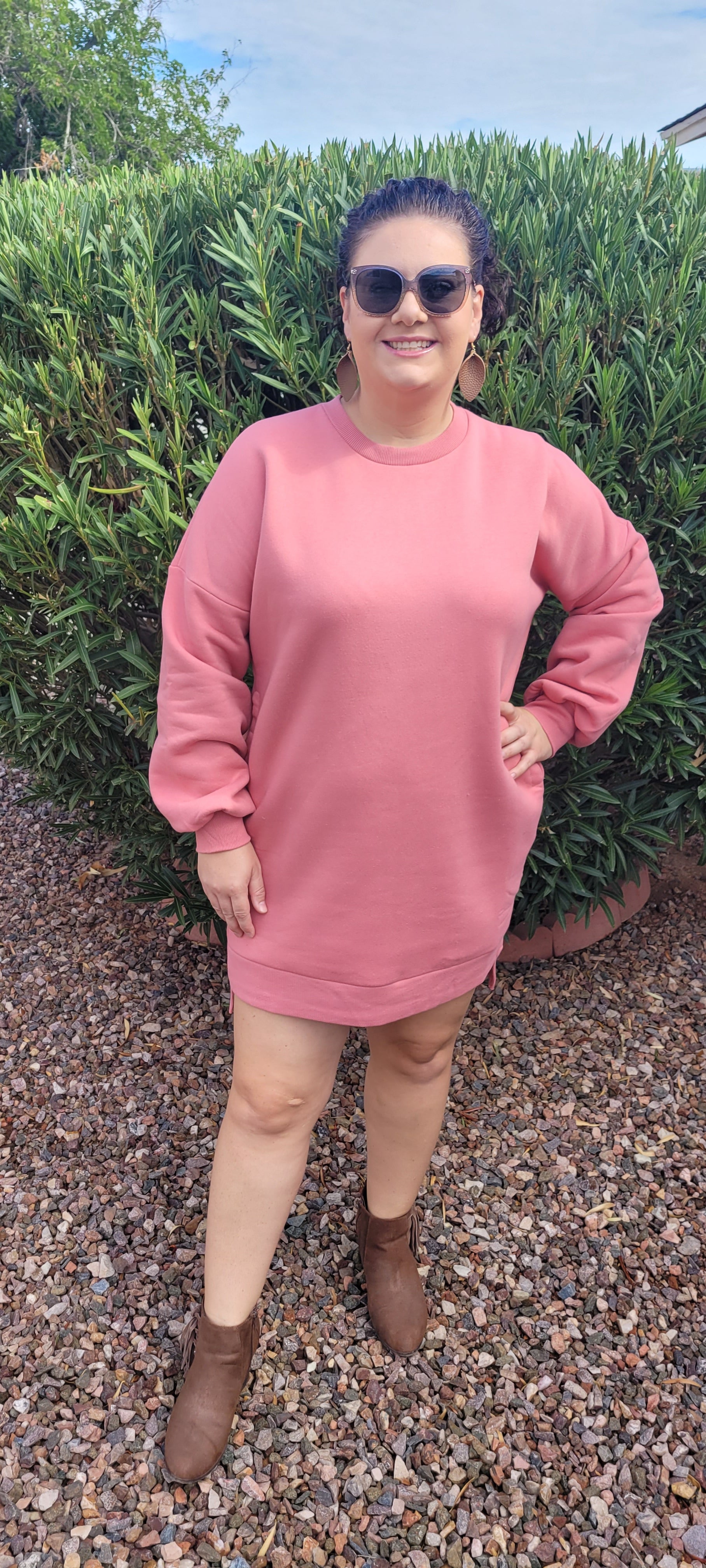 “Rock Candy” is a dusty rose sweatshirt that can be worn with leggings, jeans, or as a dress. This sweatshirt features a rounded ribbed neckline, ribbed cuffed sleeves, and two functional side pockets. It is a relaxed fit with a high-low hem. This material is very soft. Sizes small through x-large.