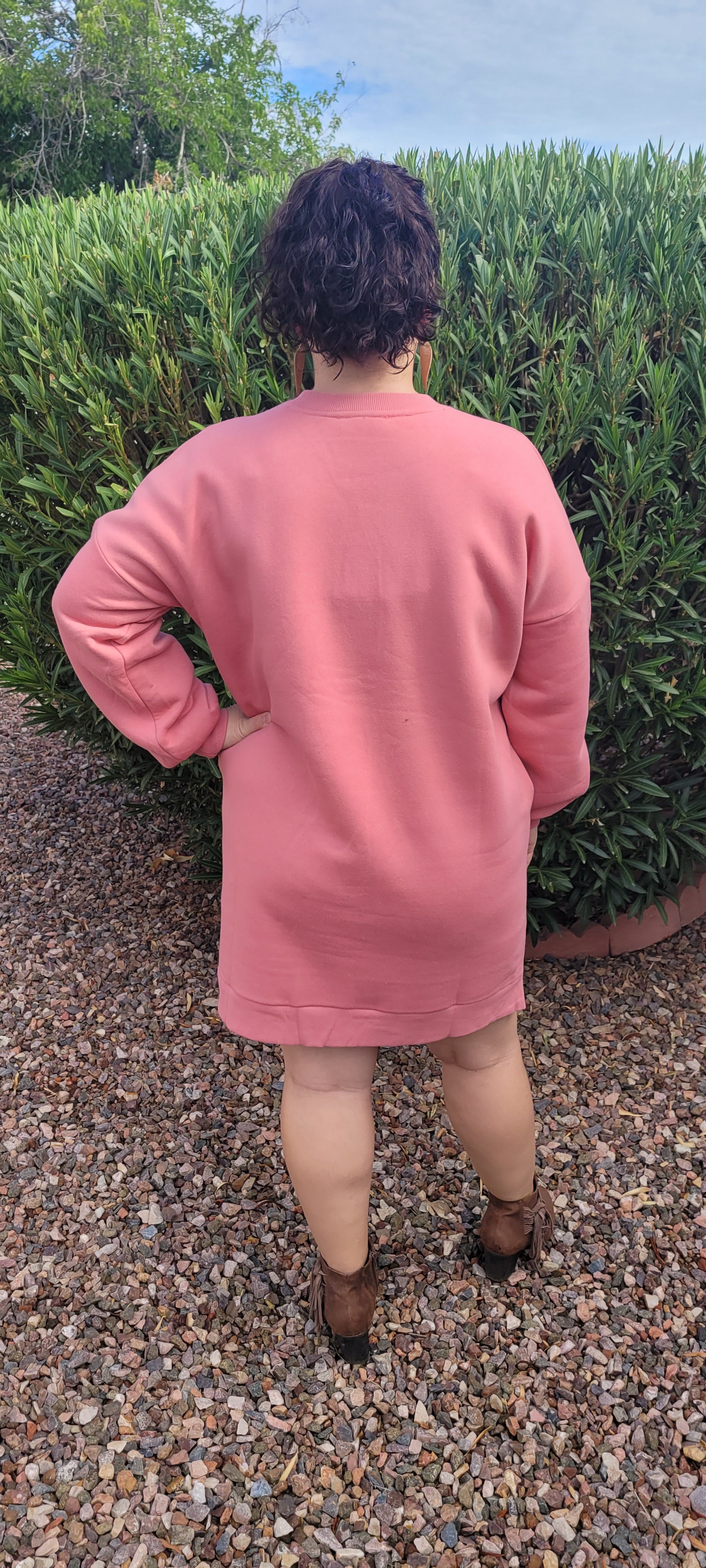 “Rock Candy” is a dusty rose sweatshirt that can be worn with leggings, jeans, or as a dress. This sweatshirt features a rounded ribbed neckline, ribbed cuffed sleeves, and two functional side pockets. It is a relaxed fit with a high-low hem. This material is very soft. Sizes small through x-large.