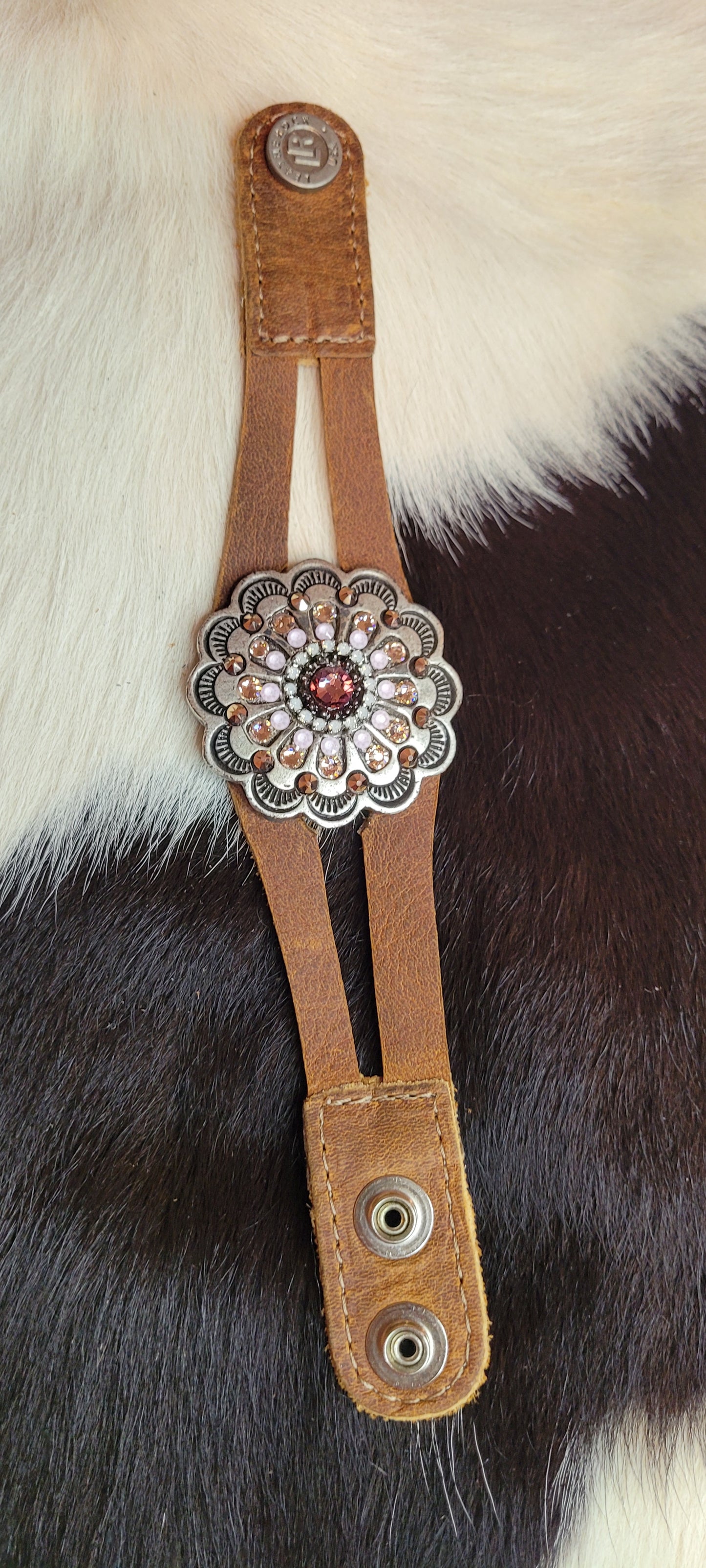 Australian crystals Genuine Leather Adjustable snap closure Color: chocolate brown Length: 8.75 inch Limited supply / one of a kind! Made in the USA