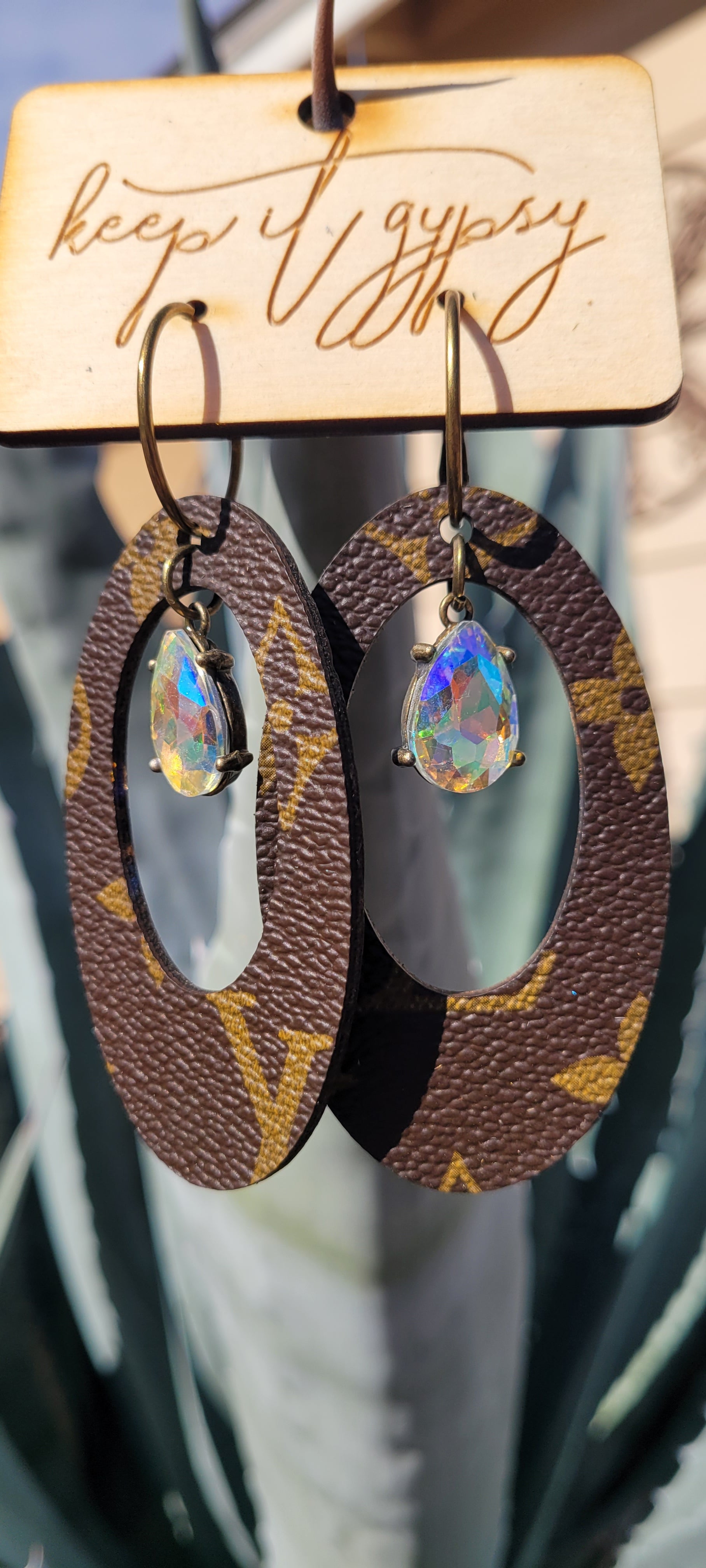 Upcycled Earrings Brown with AB Crystal  Limited supply!    Due to the nature of leather/suede, small variances of color in the skin may occur, this is in no way considered a defect. These are inherent characteristics of leather/suede and will enhance the individual look of your garment.   