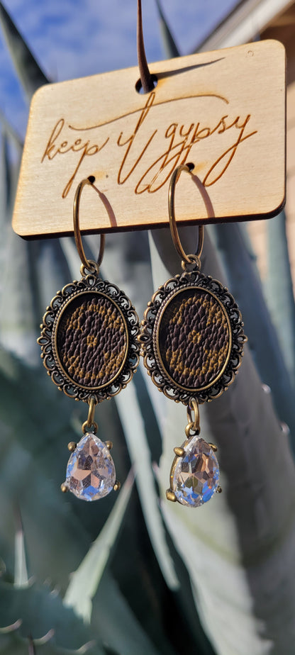 Upcycled Earrings Brown with Clear Crystal  Limited supply!    Due to the nature of leather/suede, small variances of color in the skin may occur, this is in no way considered a defect. These are inherent characteristics of leather/suede and will enhance the individual look of your garment.