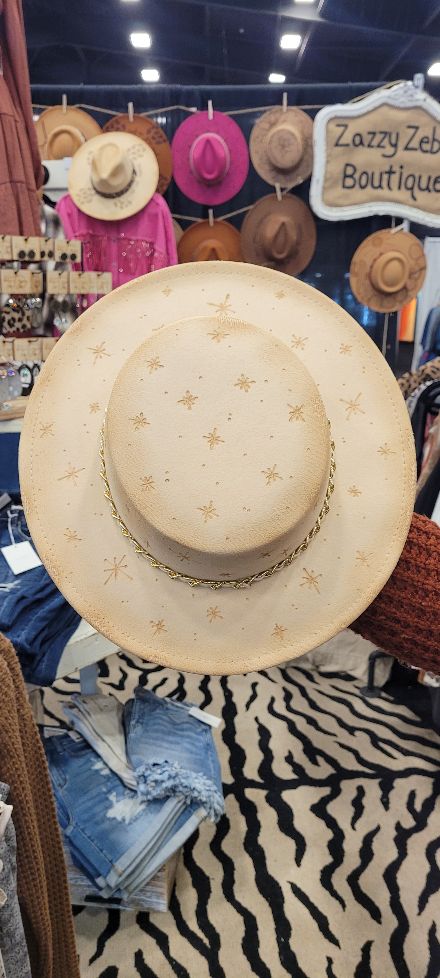 Features engraved stars Chain with a faux leather Felt hat Flat brim 100% polyester Ribbon drawstring for hat size adjustment Head Circumference: 24" Crown Height: 3.5" Brim Length: 13.5" Brim Width: 12.75" Branded & numbered inside crown Custom burned & engraved by Kayla