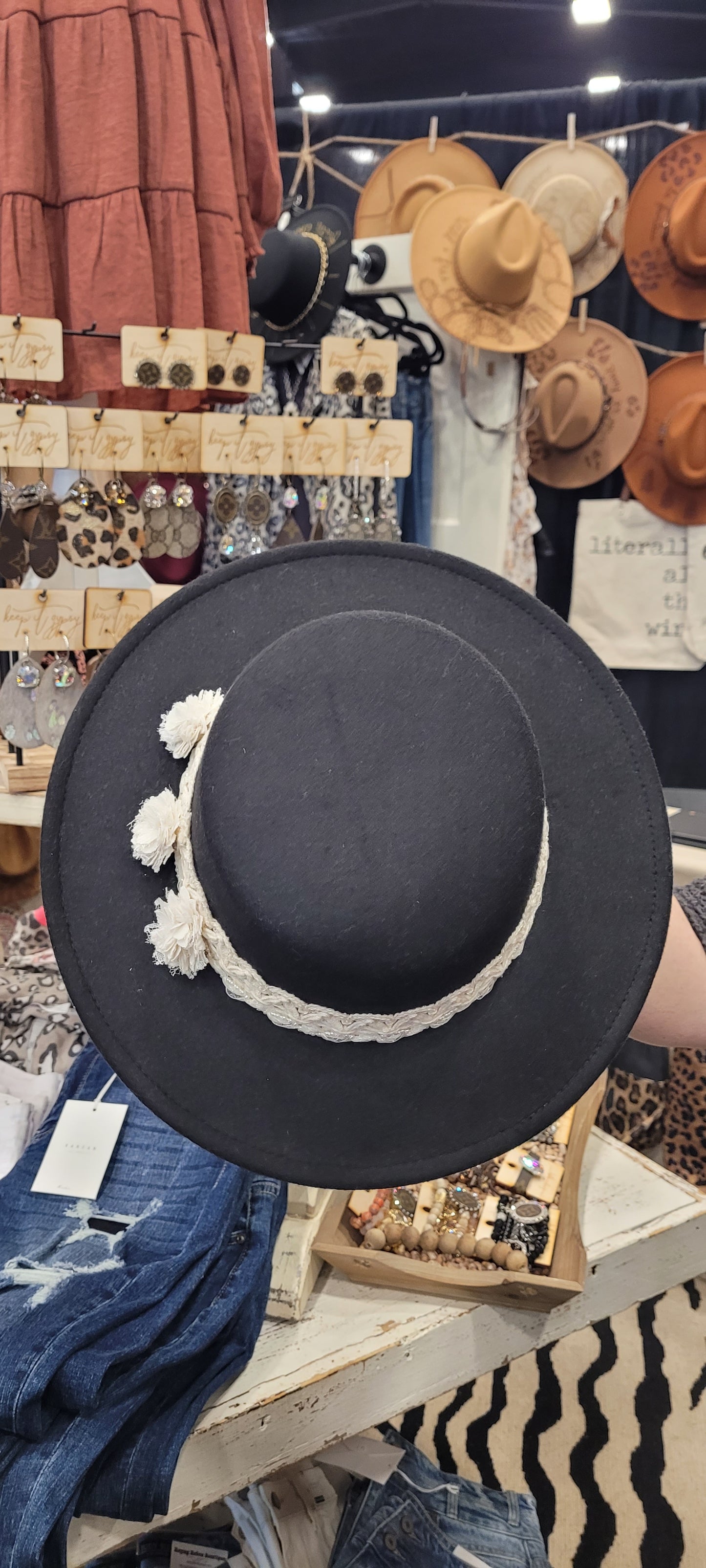 Features lace and pearl ribbon & flowers Black brim hat Felt hat Flat brim 100% polyester Ribbon drawstring for hat size adjustment Head Circumference: 24" Crown Height: 3.5" Brim Length: 13.5" Brim Width: 12.75" Branded & numbered inside crown Custom designed by Kayla