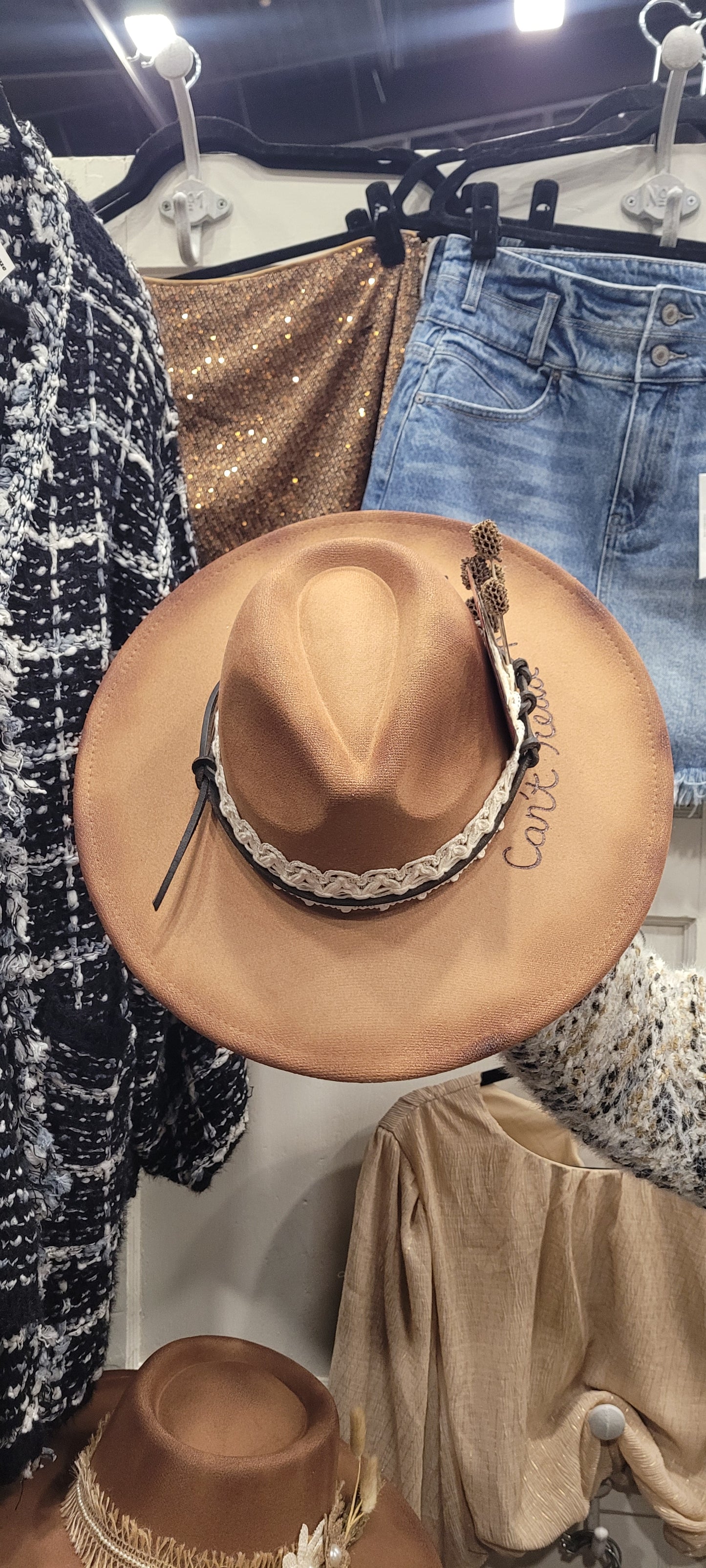 Features natural lace ribbon, leather, pine cones, playing cards & "can't read me poker face" engraving Felt hat Flat brim 90% polyester, 10% PU Ribbon drawstring for hat size adjustment Head Circumference: 24" Crown Height: 5" Brim Length: 15.75" Brim Width: 14.5" Branded & numbered inside crown Custom burned & engraved by Kayla