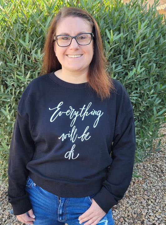 Who says you can’t look fabulous while being comfy!  This black sweatshirt features white lettering “Everything will be ok”.  This is a lightweight material.  This sweatshirt pulls over your head, and has a terry cloth like material on the inside of the sweatshirt. This little number is a shorter style sweatshirt.  Pair this sweatshirt with your favorite jeans, denim skirt or leggings. Sizes small through large.