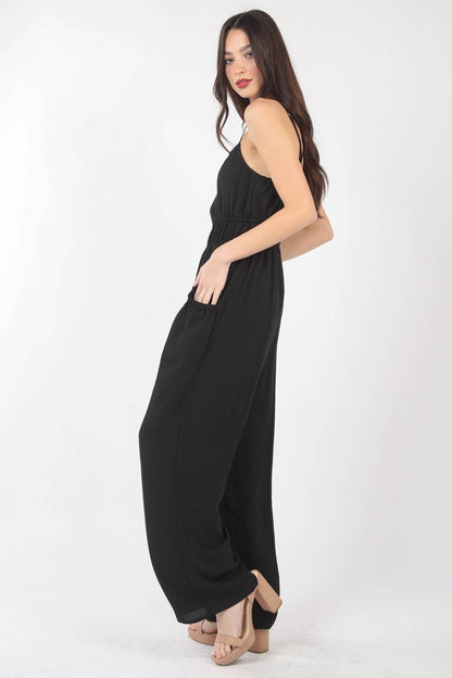 This Pintuck Detail Woven Sleeveless Jumpsuit is a chic and versatile piece for your wardrobe. The pintuck detailing adds a touch of sophistication to the sleeveless jumpsuit silhouette. Made from woven fabric, this jumpsuit offers a sleek and polished look. S - L