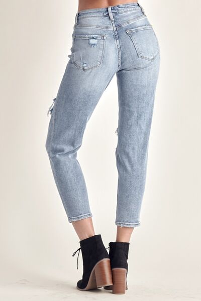 The cropped length adds a modern and stylish twist, making them versatile for various outfit combinations. Made from high-quality denim, they offer both comfort and durability. These jeans can be easily dressed up with heels or dressed down with sneakers for any occasion. Whether you're going for a casual day look or a night out with friends, these distressed slim cropped jeans will effortlessly elevate your style.